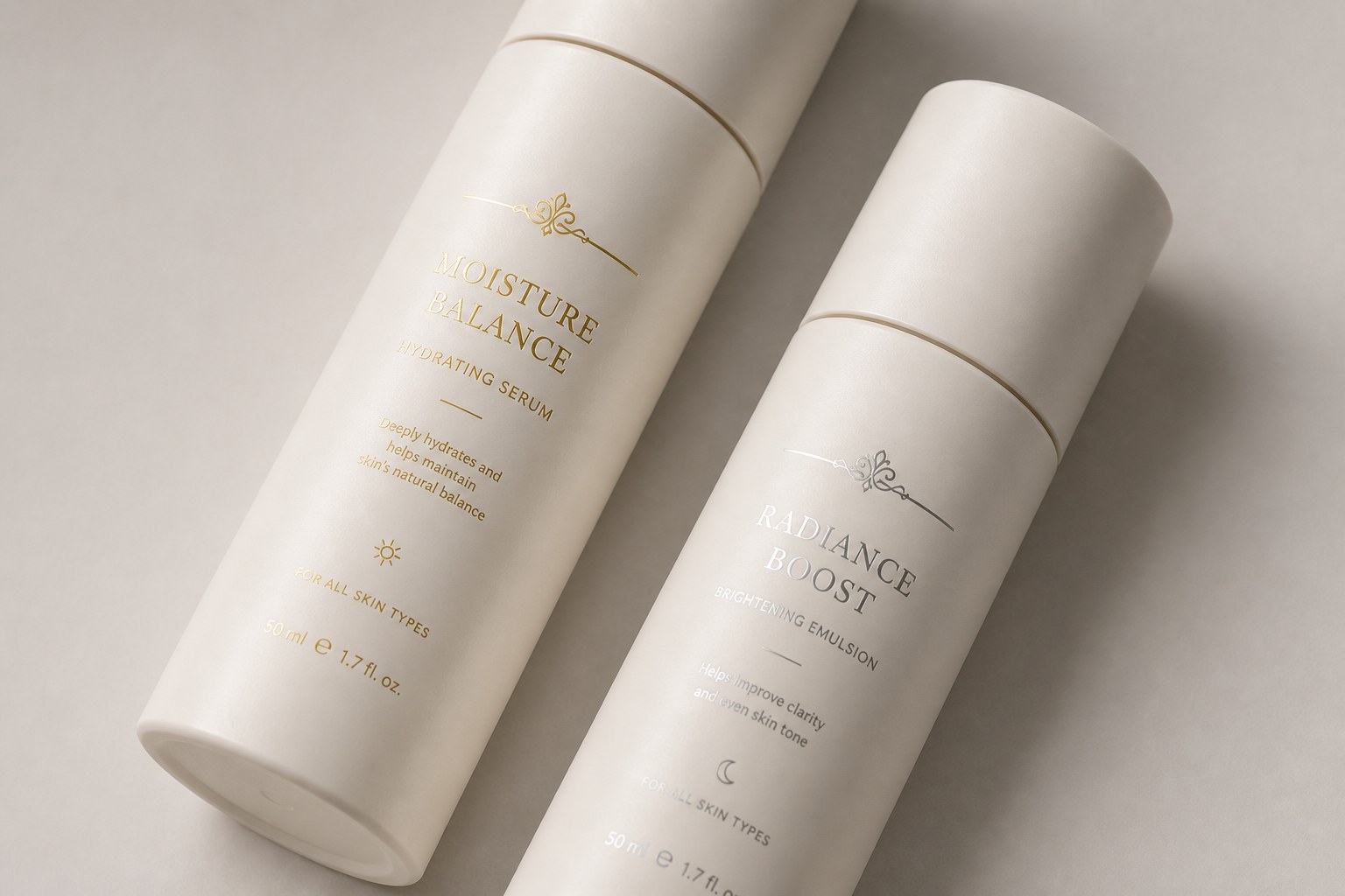 Two cream bottles with gold foil lettering and a small foil emblem
